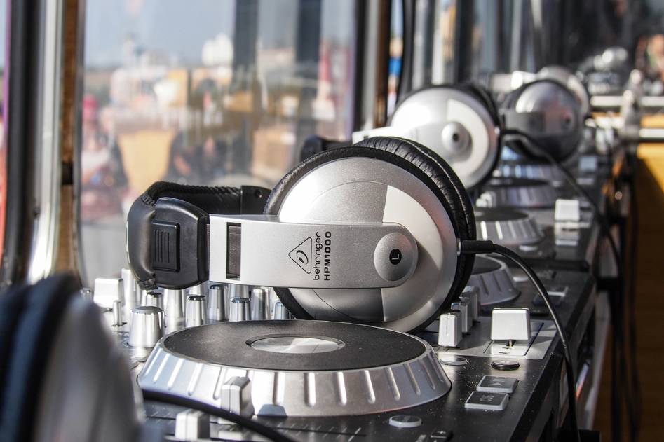 Dynamic podcast setup with microphones and headphones on a modern desk