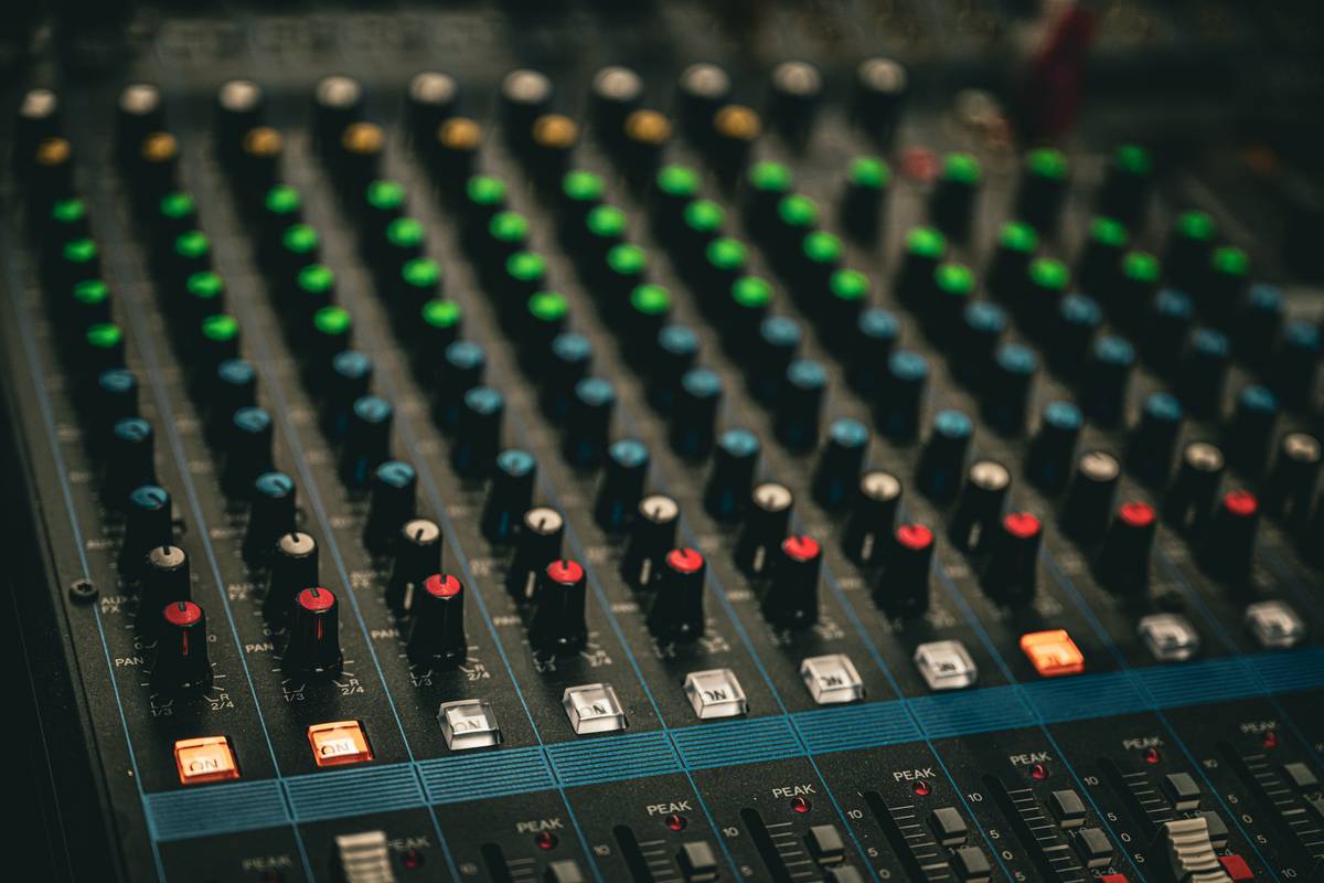 Diagram showing audio signal flow from microphone through preamp, channel strip, bus, and output in a podcast mixing setup