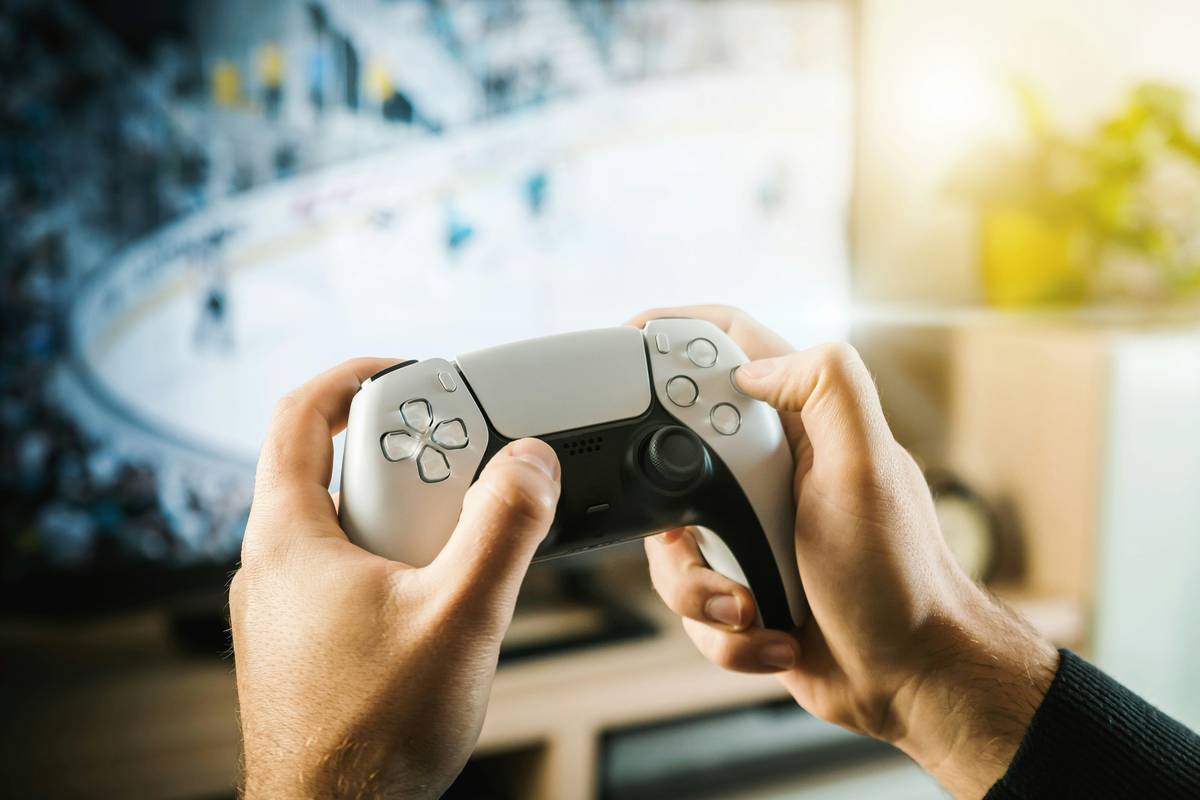 The guy is playing on the console. Modern gamepad.
